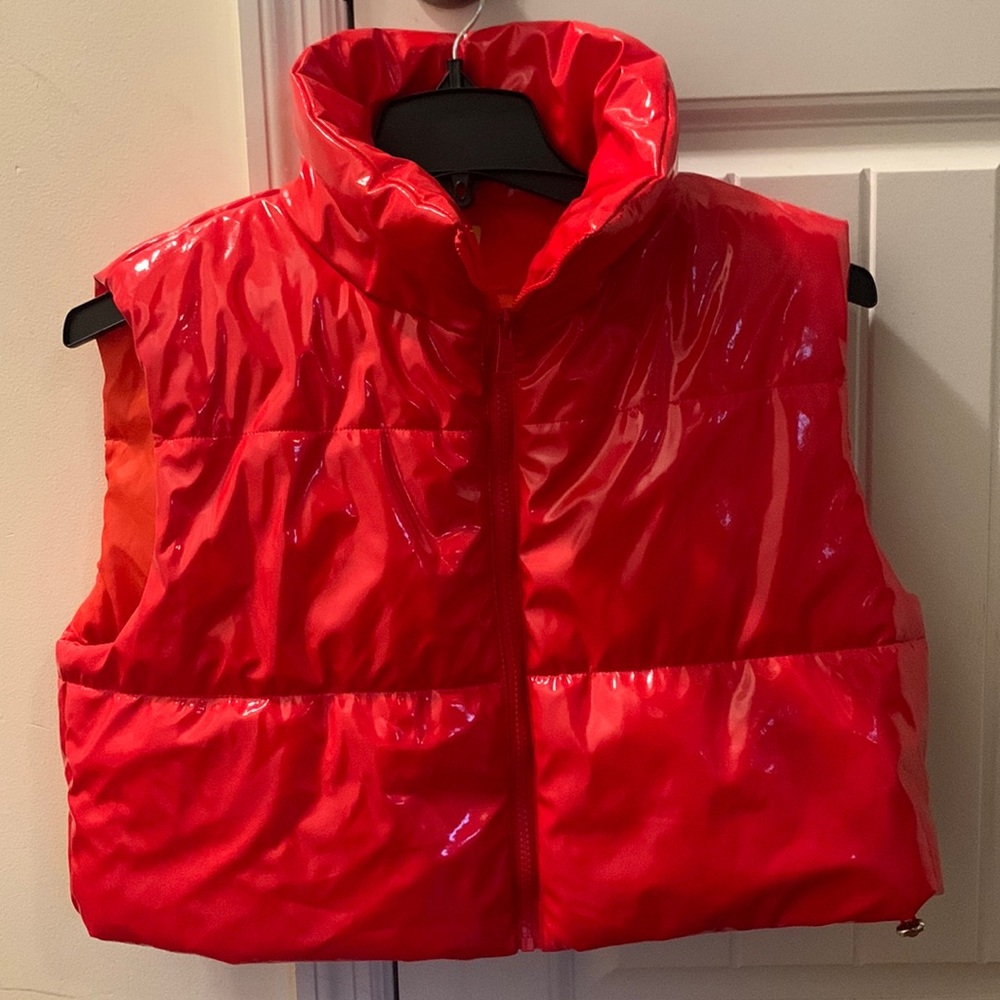 This is a lovely red vest. The size is a extra-large. I forgot where I got it.